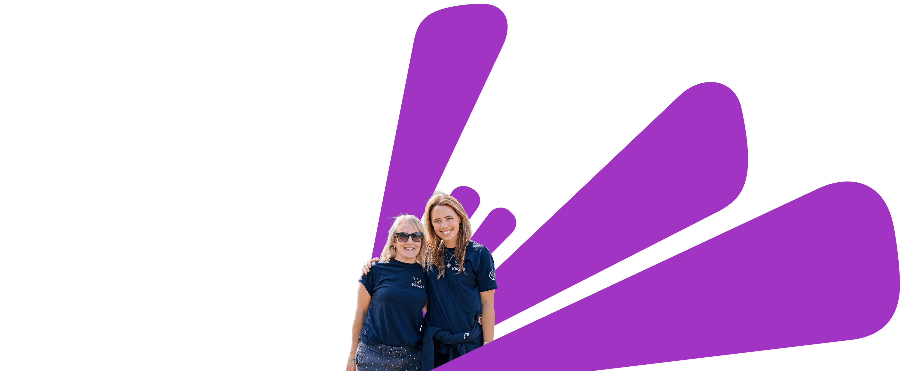 Two people standing in front of a large purple logo on a black background